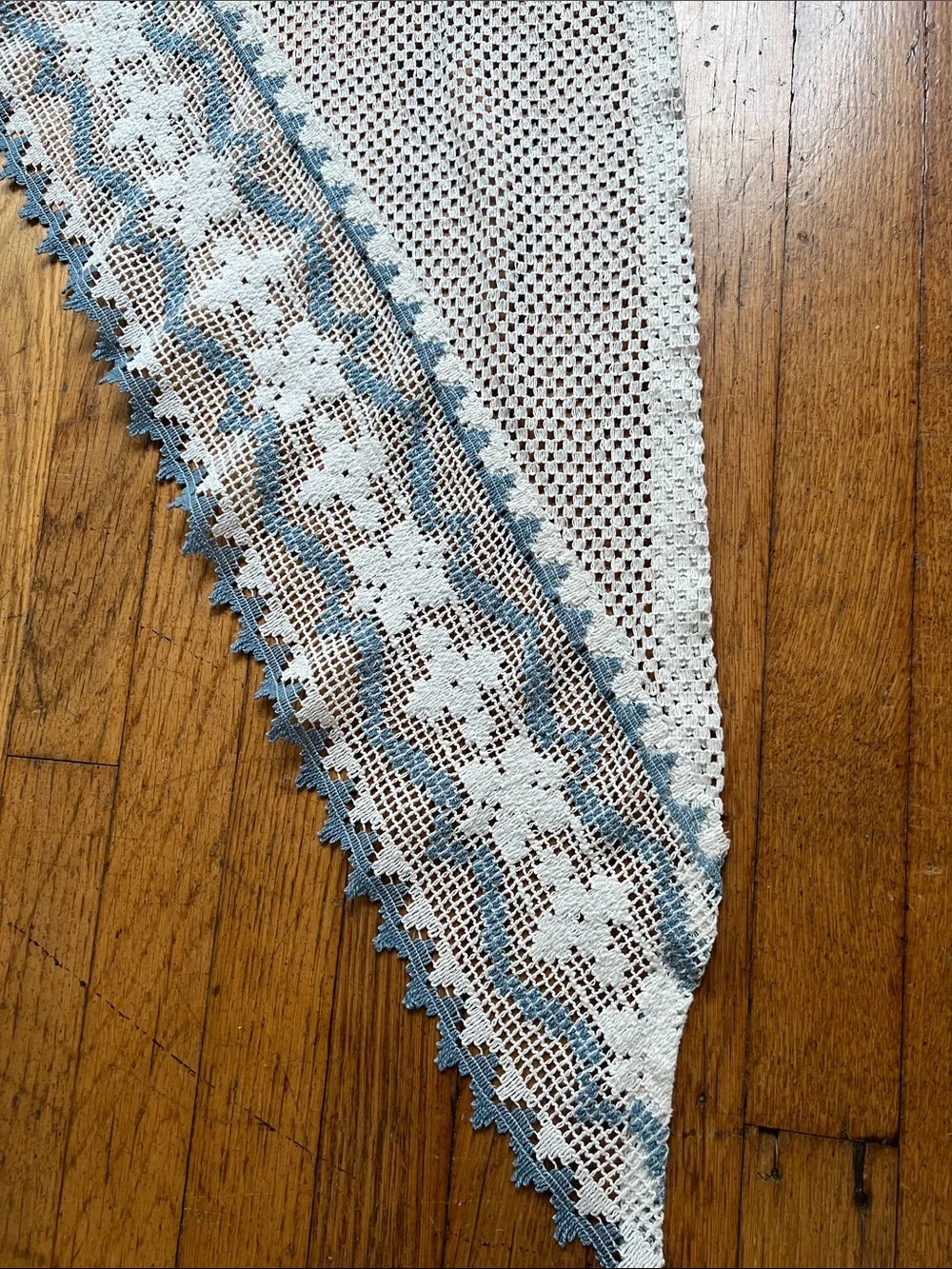 Set of curtain swags with Blue Trim.